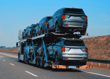 modern-semitrailer-trucks-highway-driving-right-lane-commercial-vehicle-shipping
